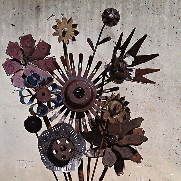 Bunch of recycled metal flowers in corrugated iron vase by Ian Michael, Designer Dirt in Albany, Western Australia 2015.jpg
