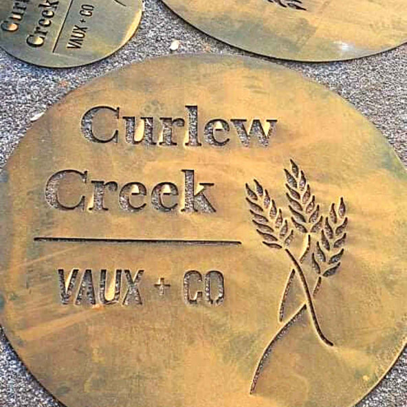 Curlew Creek corten cut out farm sign