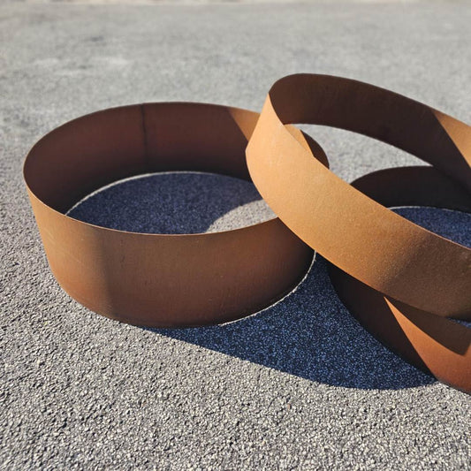 Corten steel rings on bitumen