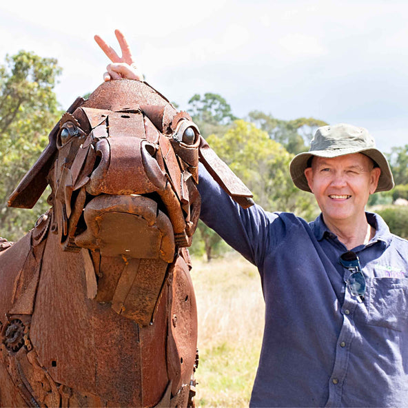 Sculptor Ian Michael with his steer sculpture