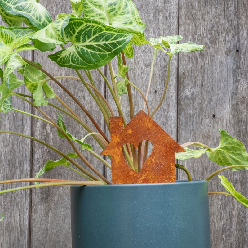 Corten House with a heart cut-out garden stake